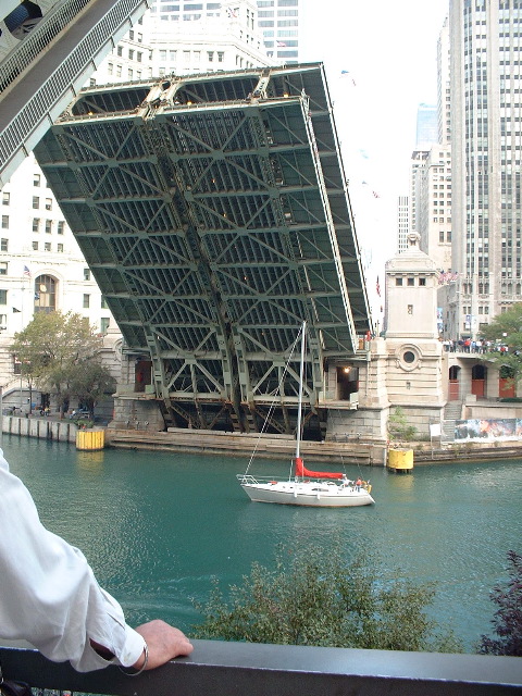 Sailboat passing under Michigan Ave. bridge