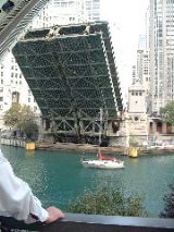 Sailboat passing under Michigan Ave. bridge